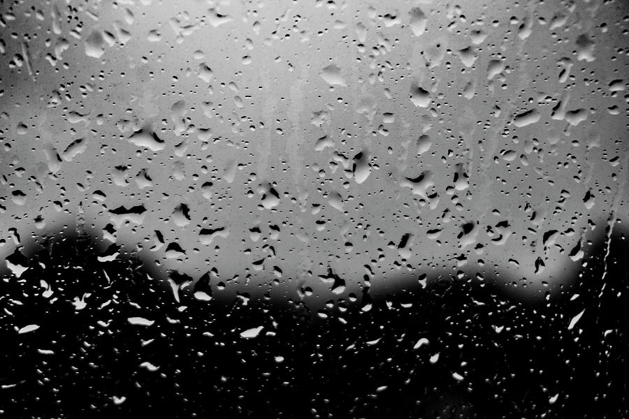 Raindrops On Glass Photograph