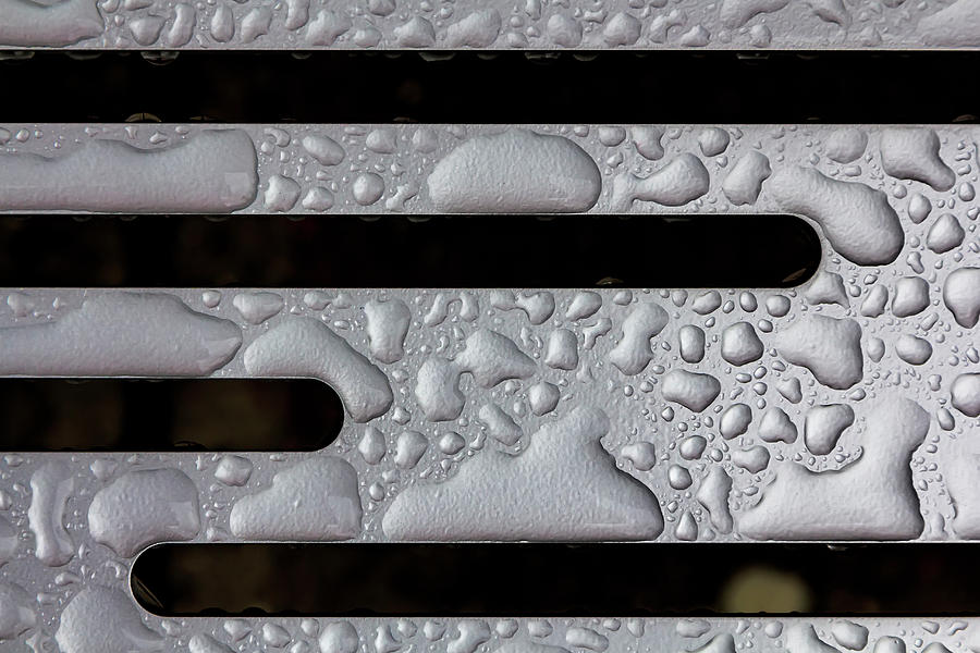 Raindrops on Metal Bench - Detail Photograph by Robert Ullmann