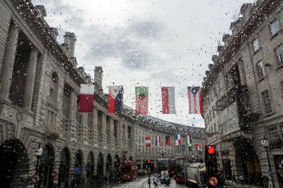 Rainy London - Regent Street Multinational Flags Photograph by Georgia Mizuleva