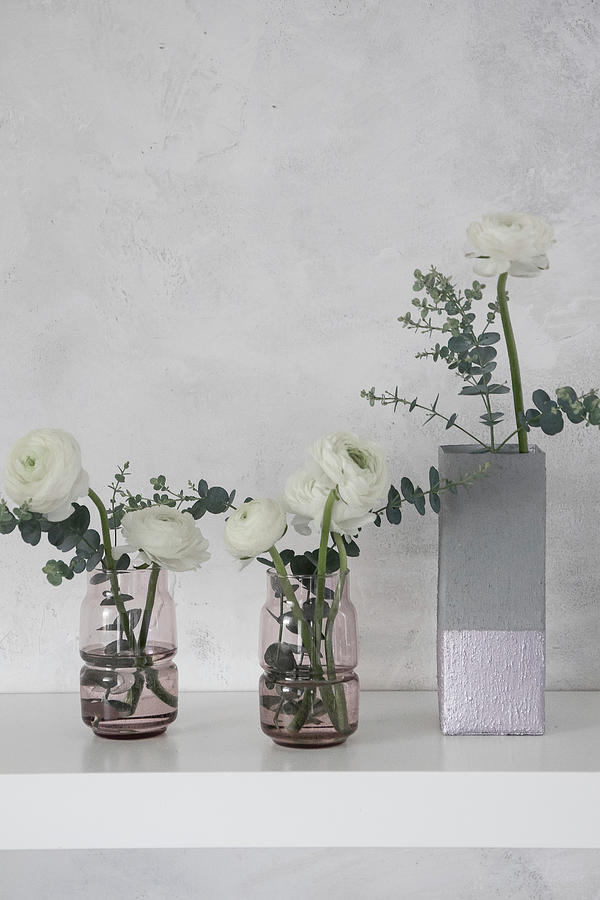 Ranunculus In Concrete-effect Vase Handmade From Milk Carton And Glass Vases Photograph by Astrid Algermissen