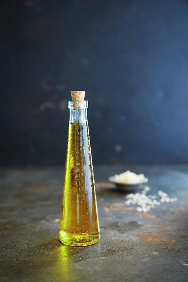 Rapeseed Oil In A Glass Bottle Photograph by Rafael Pranschke