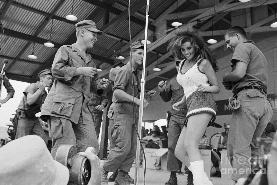 Raquel Welch Dancing With Soldiers Photograph by Bettmann