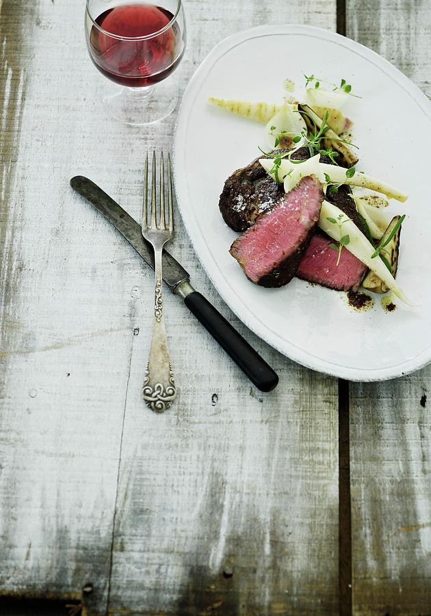 Rare Venison Steak With Oven-roasted Vegetables Photograph by Mikkel Adsbl