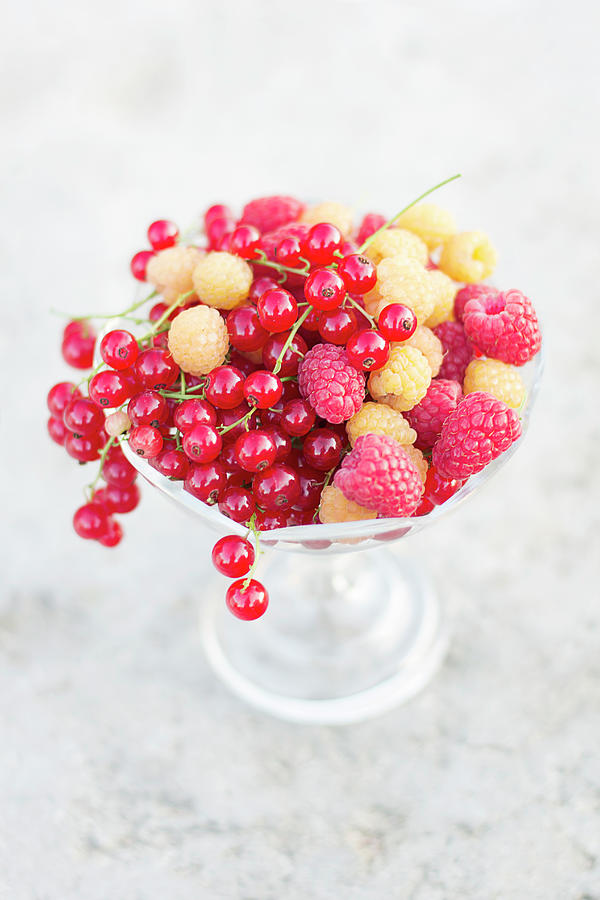 Raspberries, Golden Raspberries And Redcurrants In A Footed Crystal Bowl Photograph by Zappie