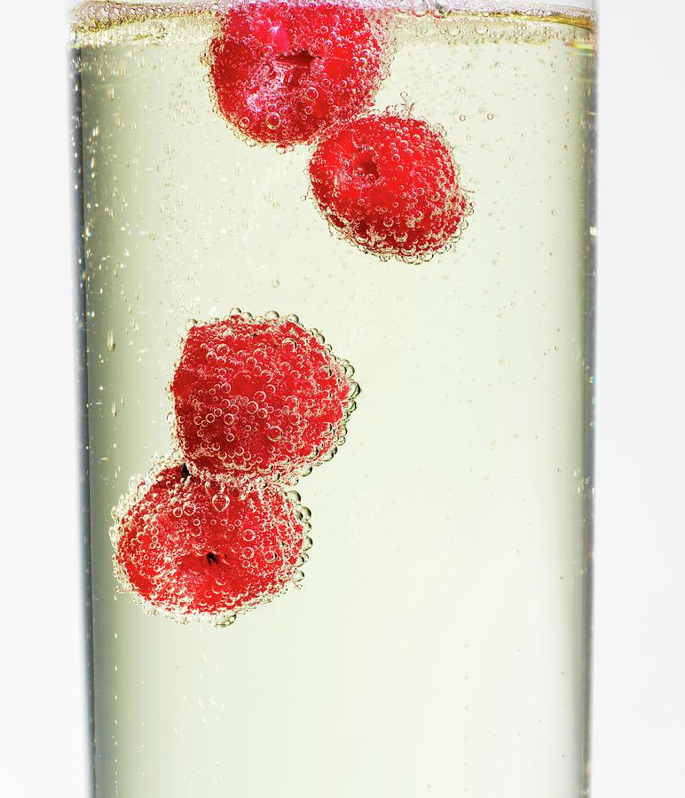 Raspberries In Champagne close-up Photograph by Feig & Feig