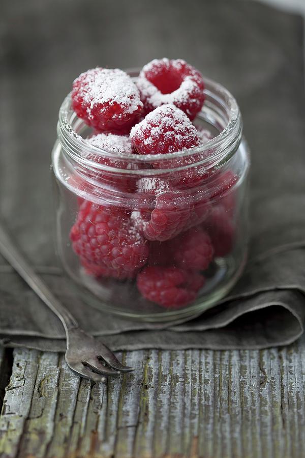 Raspberries With Homemade Raspberry Icing Sugar Photograph by Martina Schindler