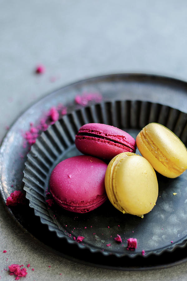 Raspberry And Lemon Macaroons Served On A Black Tray Photograph by Diana Kowalczyk