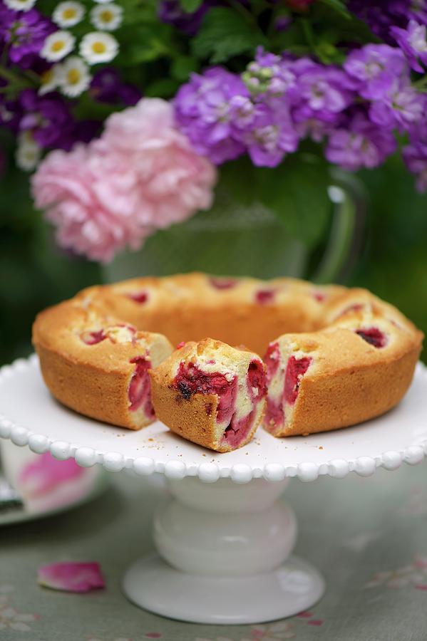 Raspberry And Orange Cake On A Cake Buffet In A Garden Photograph by Winfried Heinze