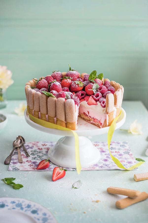 Raspberry And Strawberry Charlotte On A Cake Stand, Slice Removed Photograph by Magdalena Hendey