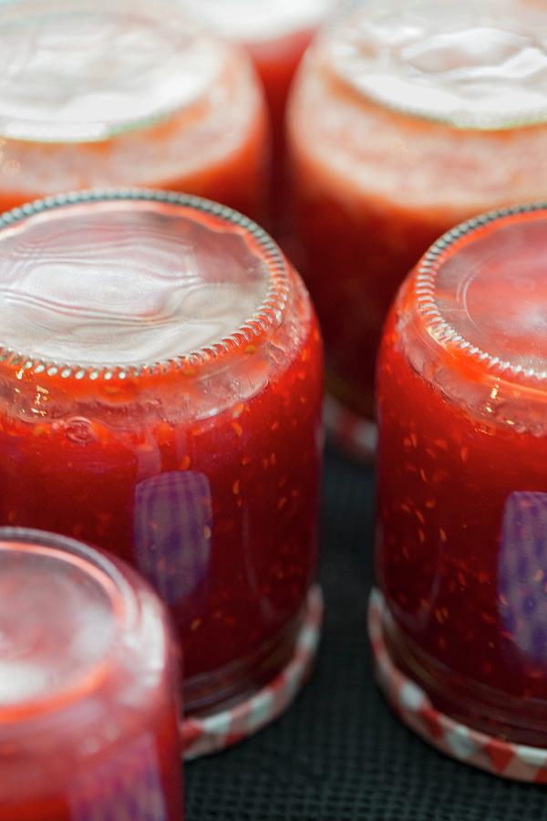 Raspberry Jam In Upsidedown Jars Photograph by Tina Engel Pixels