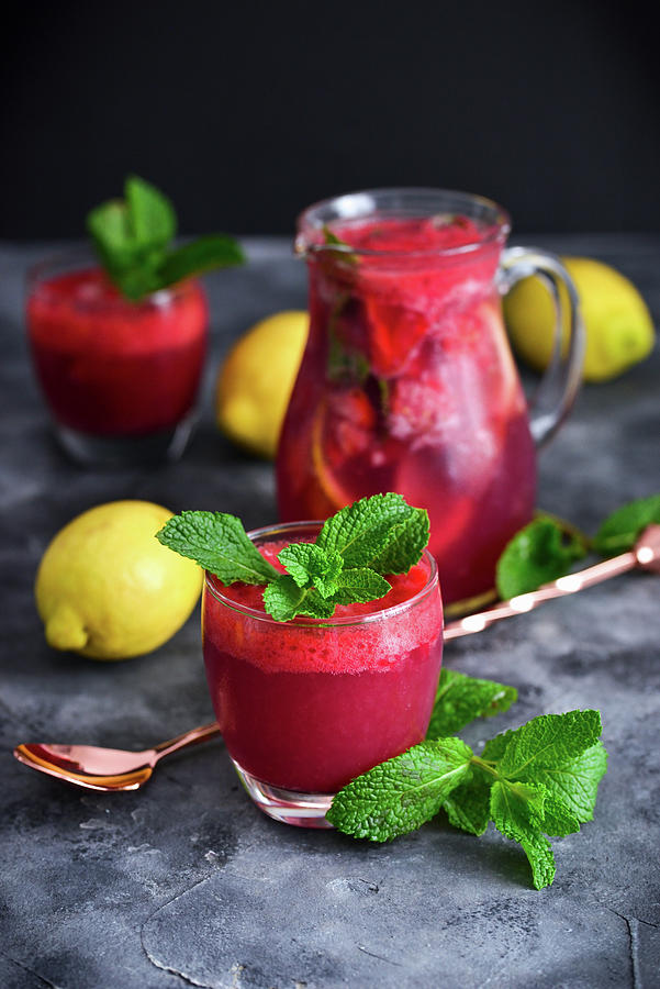 Raspberry Lemonade In A Jug And A Glass Photograph by Karolina Smyk