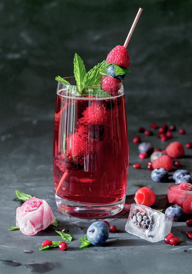 Raspberry Lemonade With Mint And Ice Cubes Photograph by Brbel Bchner