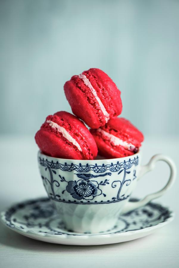 Raspberry Macaroons In A Cup Photograph by Magdalena Hendey