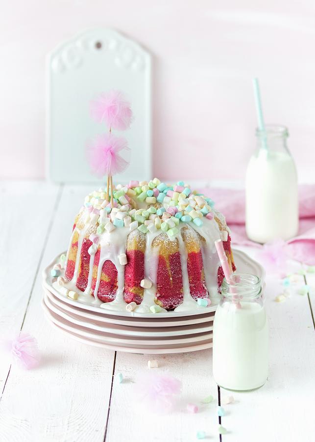 Raspberry Marble Gugelhupf With Marshmallows For A Birthday Party Photograph by Emma Friedrichs