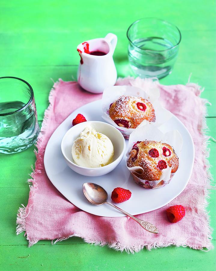 Raspberry Muffins And Vanilla Ice Cream Served With Raspberry Sauce Photograph by Ira Leoni