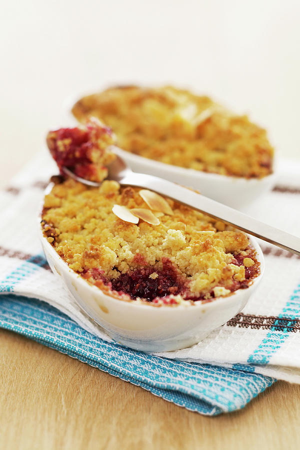 Raspberry,pear And Almond Crumble Photograph by Fnot