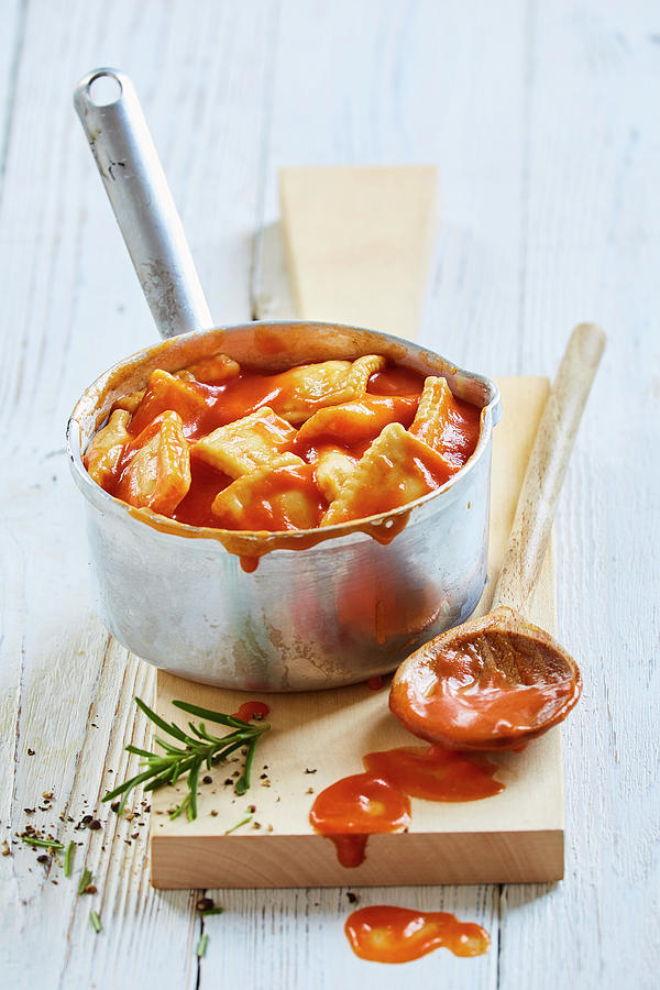 Ravioli With Tomato Sauce From A Tin In A Pan Photograph by Sven C. Raben