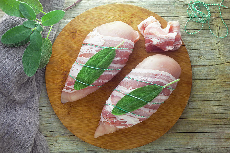 Raw Chicken Breast With Bacon And Sage Photograph by Barbara Pheby
