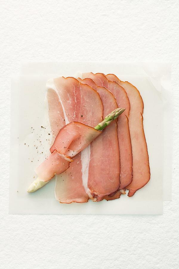 Raw Ham And Asparagus Photograph by Michael Wissing