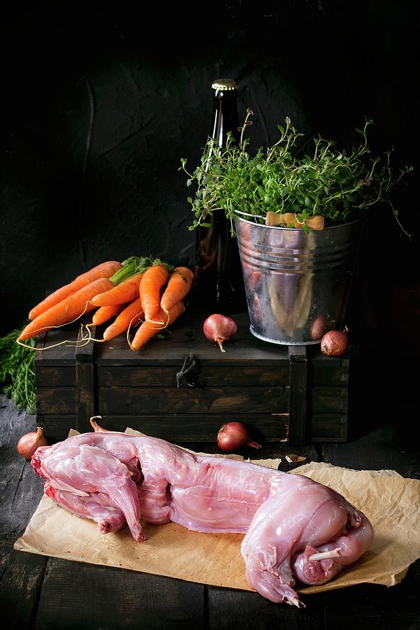 Raw Hare On A Piece Of Paper With Ingredients On A Small Wooden Crate Photograph by Natasha Breen