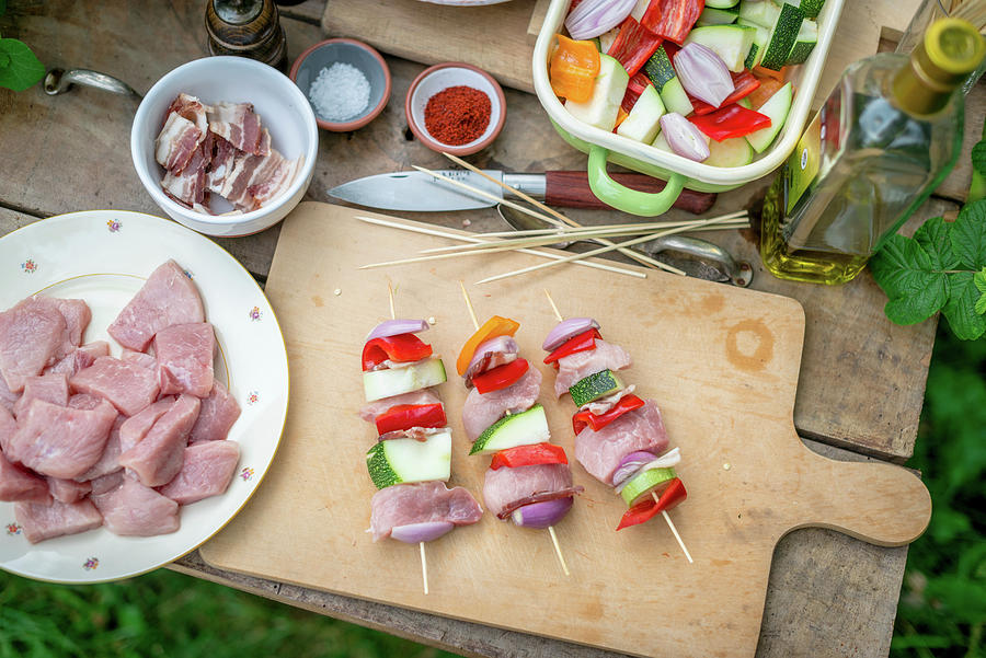 Raw Meat Skewers With Pork, Bacon And Vegetables On A Wooden Board Photograph by Sebastian Schollmeyer