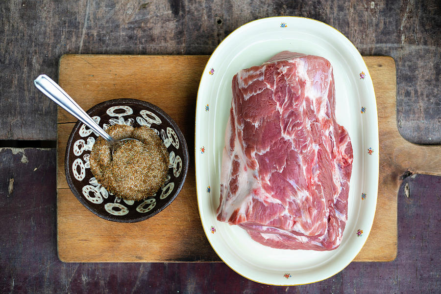Raw Pork Collar And A Rub For Making Pulled Pork Photograph by Sebastian Schollmeyer