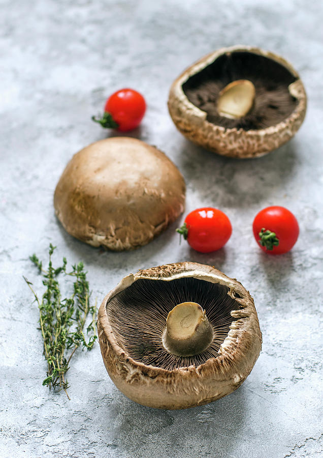 Raw Portobello Mushrooms, Thyme Sprigs And Cherry Tomatoes Photograph by Gorobina