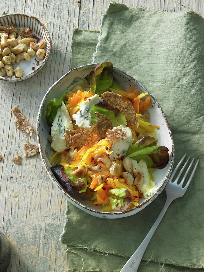 Raw Pumpkin Salad With Cashew Nuts, Yellow Carrots And Coriander With Blue Cheese Photograph by Jan-peter Westermann