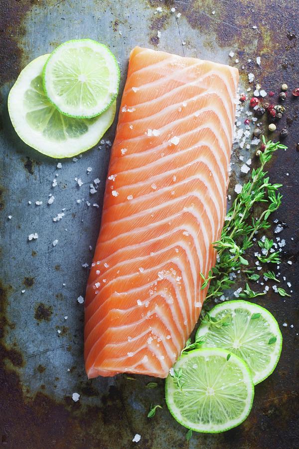 Raw Salmon Fillet On A Metal Surface Photograph by Barbara Pheby
