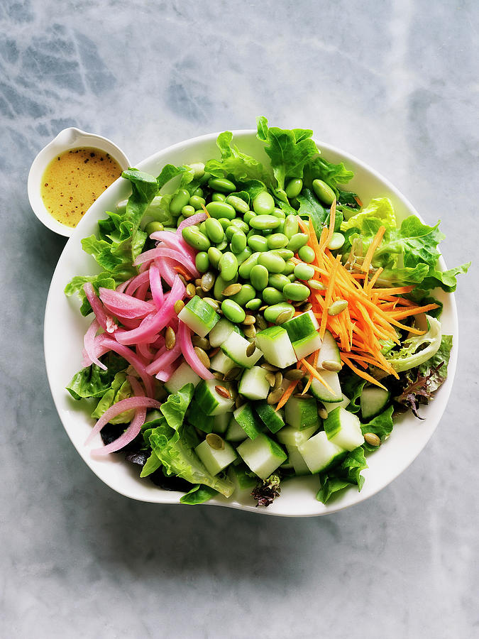 Raw Vegetable Bowl With Edamame, Carrots, Cucumber And Picklled Onions Photograph by Valerie Janssen