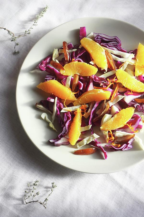 Raw Winter Salad With Sliced Cabbage, Dates, Oranges, Lemons Zest And Thyme Photograph by Lee Parish