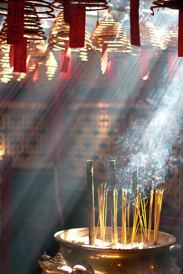 Rays Of Light Through Incense Coils Photograph by Sirintira Maneesri