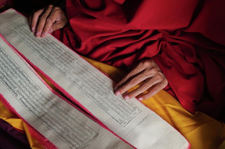 Reading Bouddhist Text In Kham, Tibet Photograph by Ducoin David
