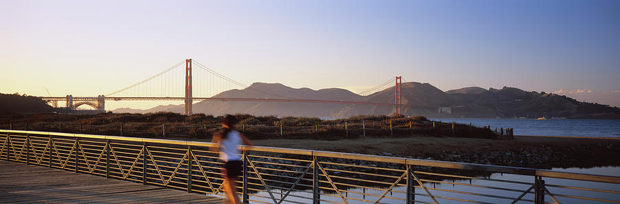 Golden Gate Bridge Photograph - Rear View Of A Woman Jogging by Panoramic Images