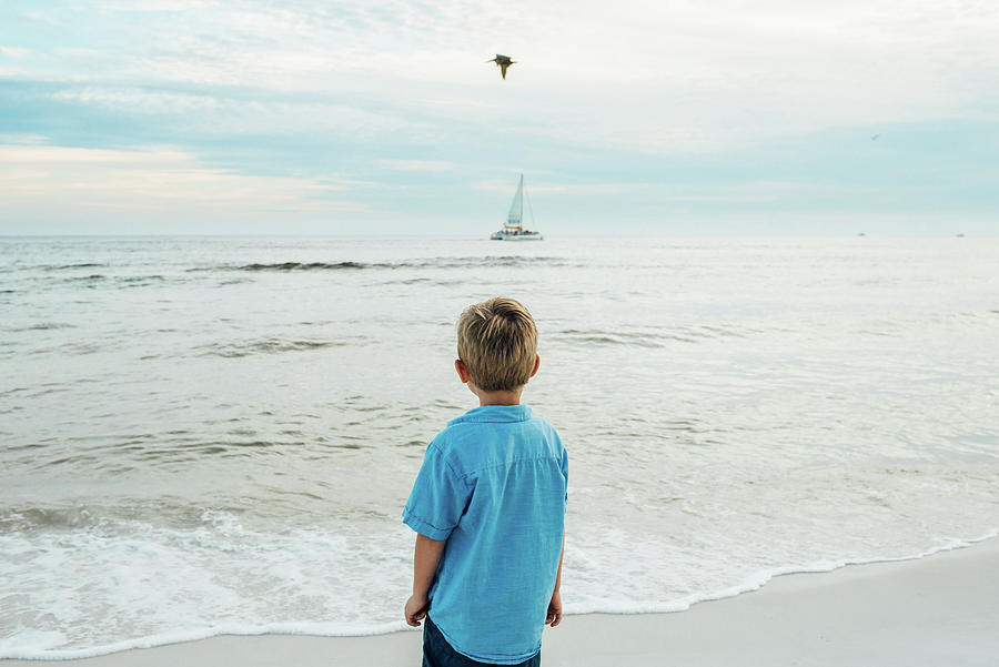 Nature Photograph - Rear View Of Boy Standing At Panama City Beach by Cavan Images