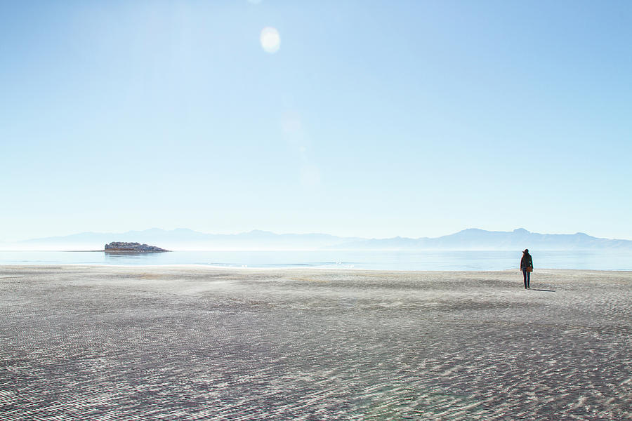 Nature Photograph - Rear View Of Woman Walking At Antelope Island Against Clear Sky During Sunny Day by Cavan Images