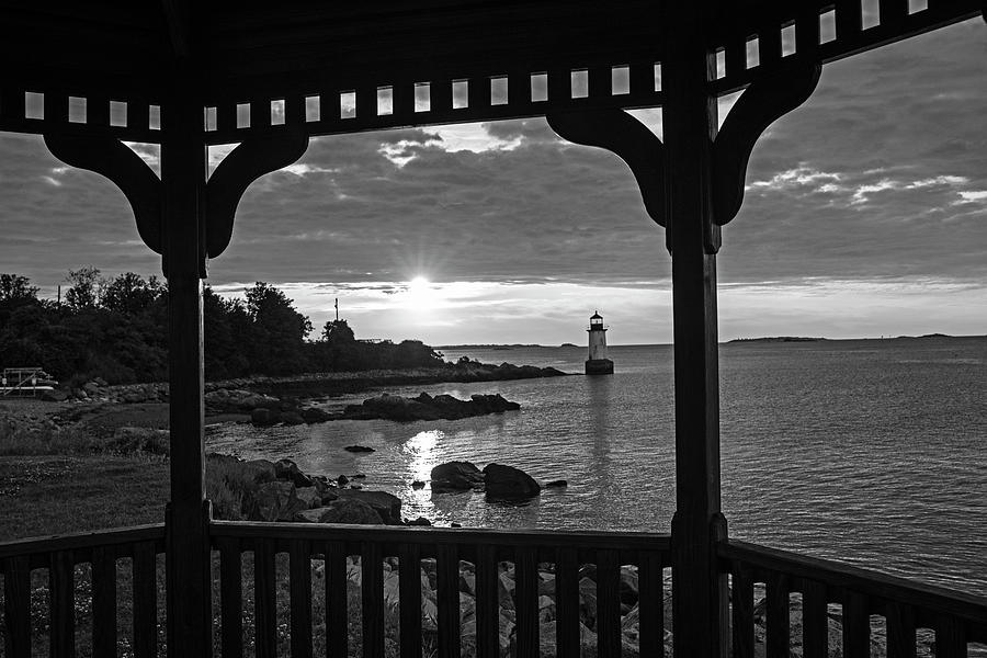Red and Gold sunrise Salem MA Winter Island Fort Pickering Light From the Gazebo Black and White Photograph by Toby McGuire