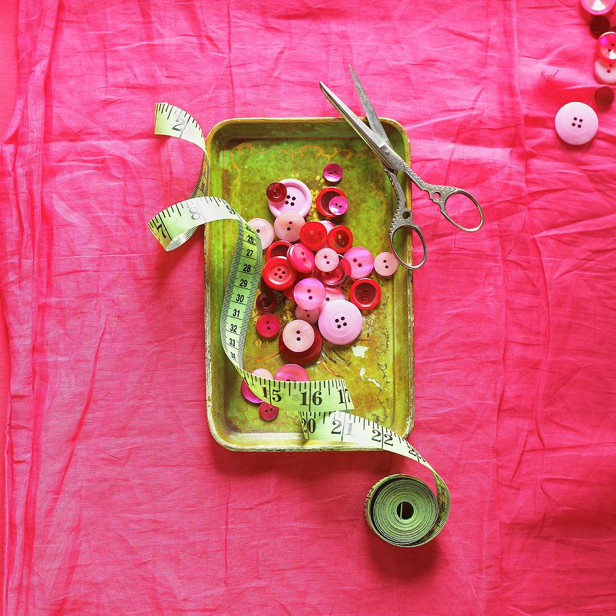Red And Pink Buttons In Metal Dish With Tape Measure And Scissors Photograph by Vincent Noguchi Photography