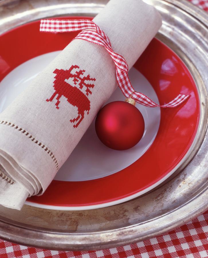Red And White Gingham Ribbon, Bauble And Linen Napkin Embroidered With Stag Motif Photograph by Veronika Stark
