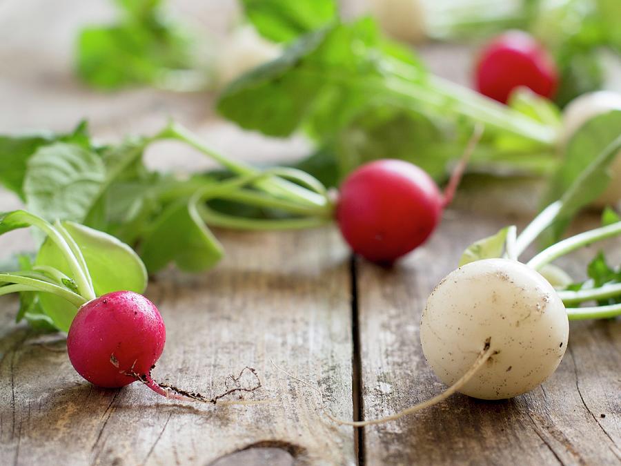 Red And White Radishes On A Wooden Table Photograph by Agnes Swart