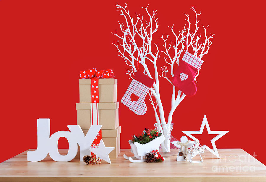 Red and white theme Christmas table decorations.  Photograph by Milleflore Images