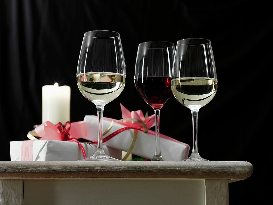 Red And White Wine In Glasses, Alongside Presents Photograph by Kng, Ruth