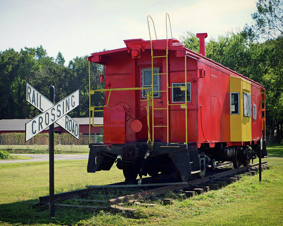 Red and Yellow Caboose at Nassawadox Photograph by Bill Swartwout