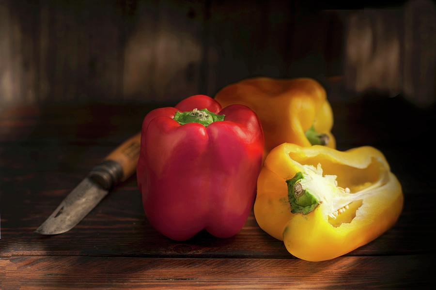Red And Yellow Peppers, Whole And Halved Photograph by Piga & Catalano S.n.c.