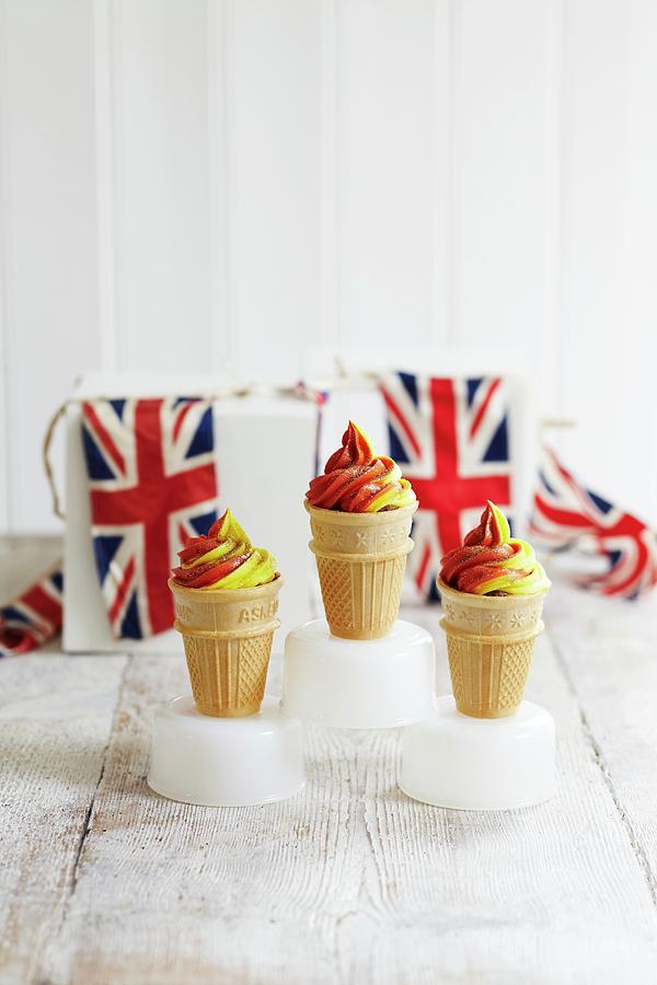 Red And Yellow Soft-serve Ice Cream In Cones Photograph by Charlotte Tolhurst
