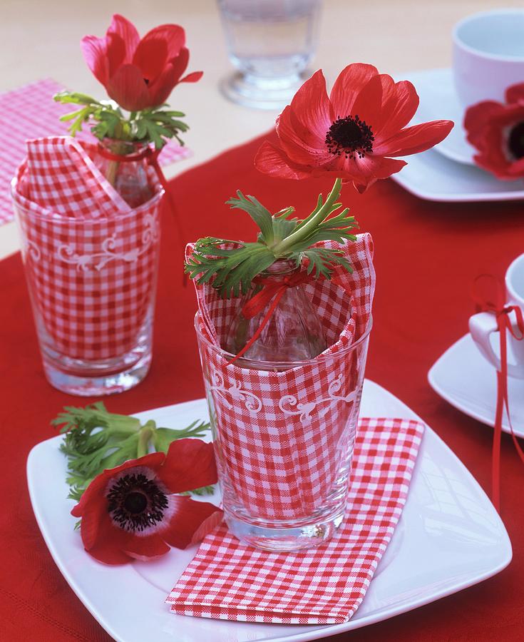 Red Anemones In Glasses table Decoration Photograph by Strauss, Friedrich
