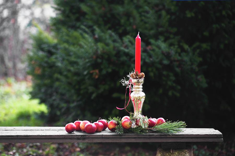 Red Apples And Pine Cones Around Red Candle In Silver Candlestick Photograph by Alicja Koll