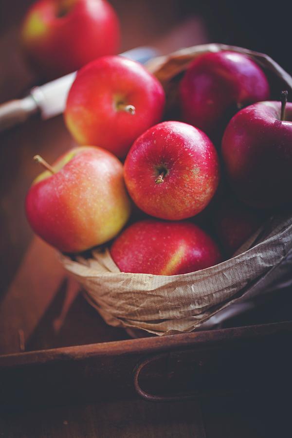 Red Apples In A Paper Bag Photograph by Eising Studio