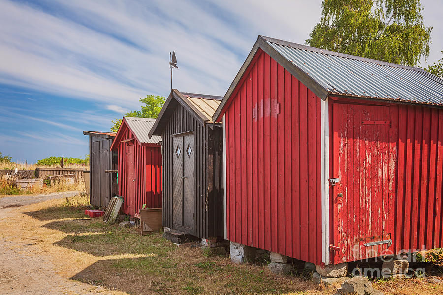 Red beach huts Photograph by Sophie McAulay