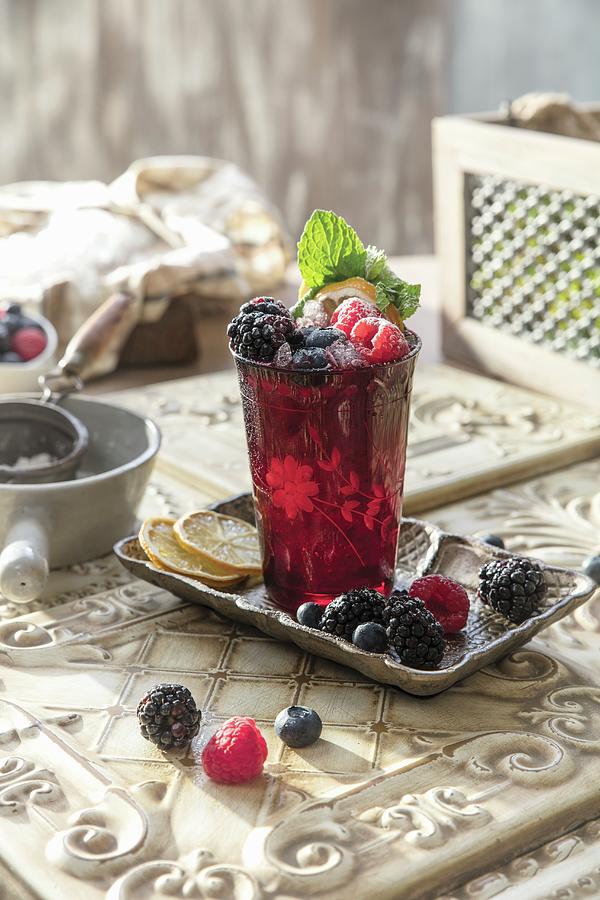 Red Berry Cocktail In A Glass Decorated With Fresh Berries Photograph by Cindy Haigwood